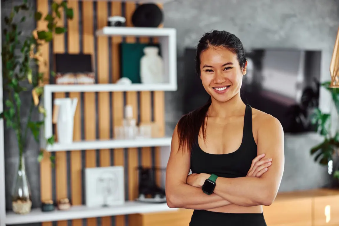 portrait-of-a-smiling-asian-fitness-woman-standing-2026-01-09-12-05-05-utc